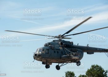 Tyumen, Russia - June 23, 2017: Army Games. Engineering Formula contest. Highest military and engineering school ground. Military helicopter MI-8 at small height